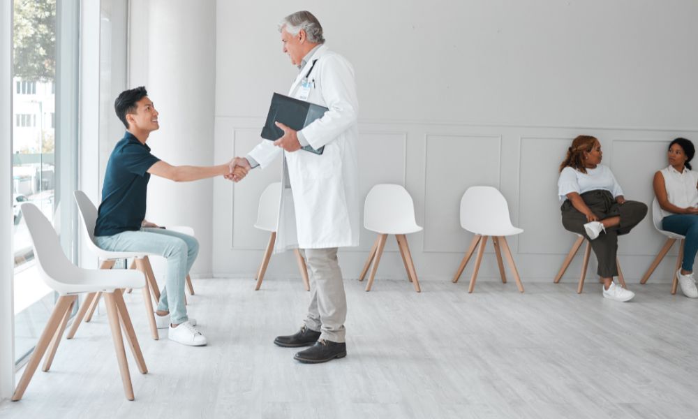 A doctor and patient shaking hands