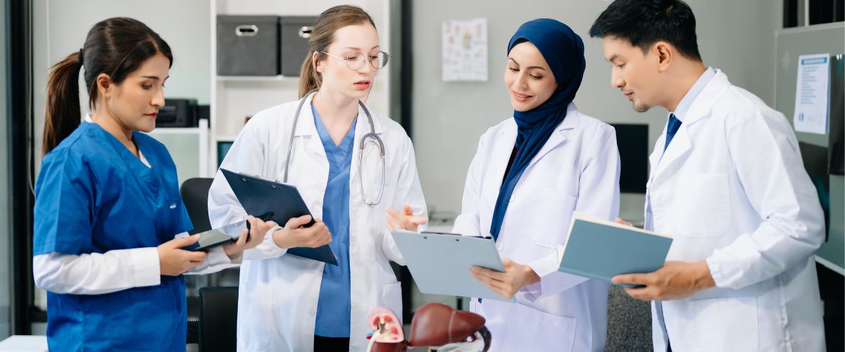 Four medical professionals coordinating with each other