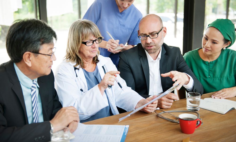 Medical professionals and business brokers having a meeting