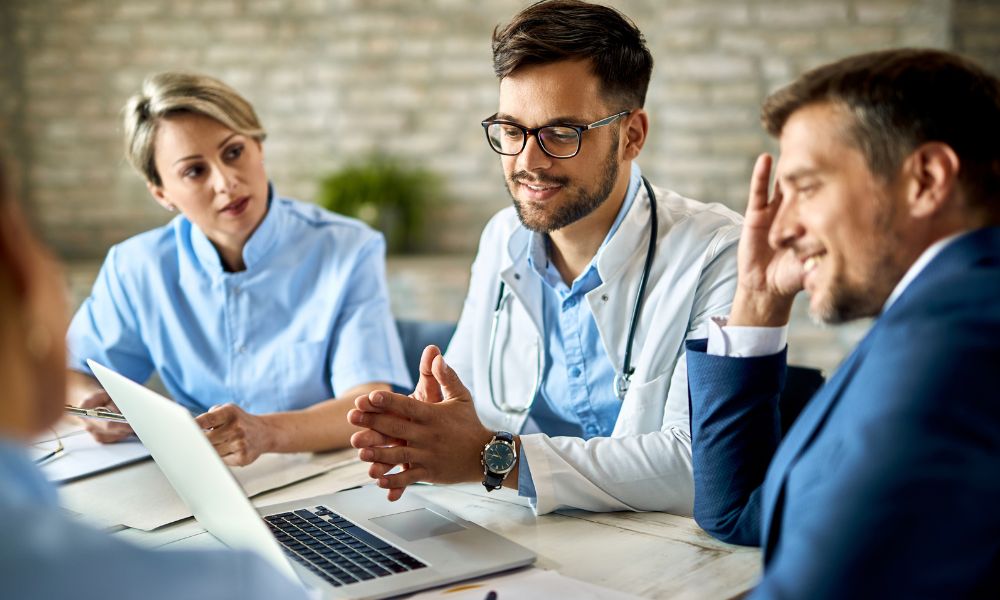 a business broker meeting with medical practice staff
