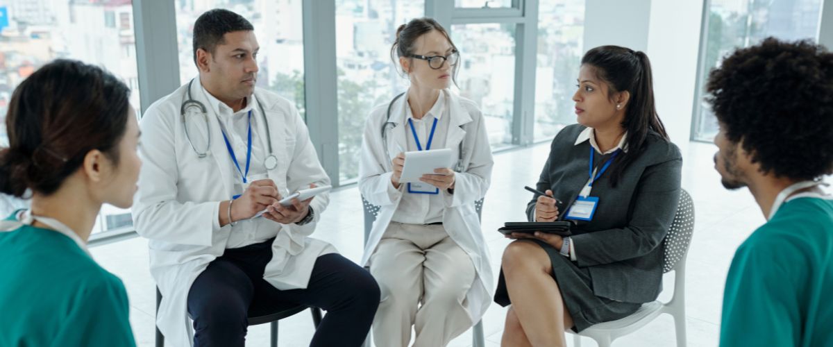 a medical team having a meeting regarding transitions