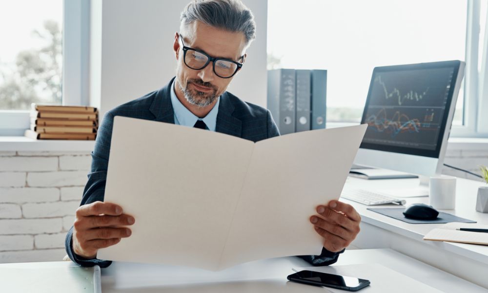 a broker reviewing documents