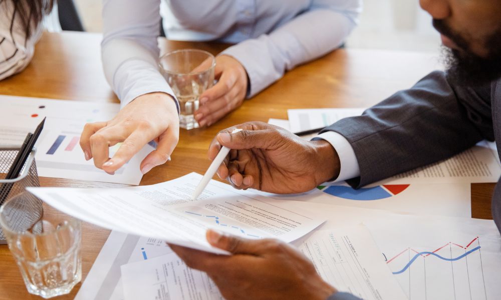 two people reviewing financial documents